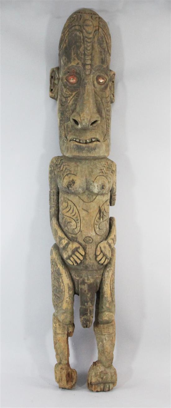 A Sepik River large carved wooden stylised male figure